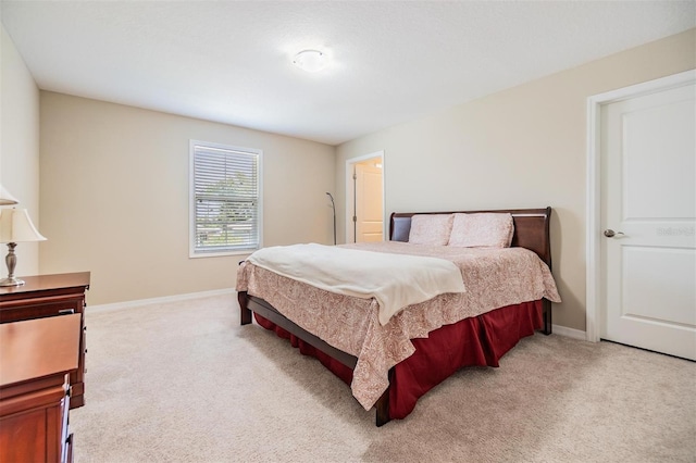 bedroom featuring light colored carpet