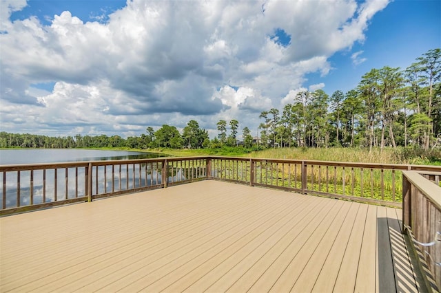 wooden terrace featuring a water view