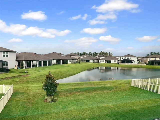 exterior space featuring a yard and a water view