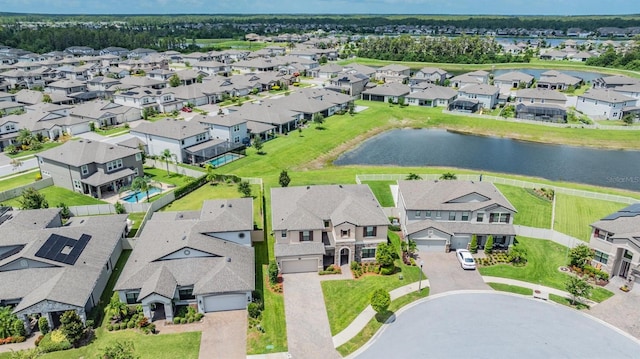 drone / aerial view with a residential view and a water view