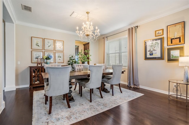 dining area featuring visible vents, baseboards, wood finished floors, and crown molding