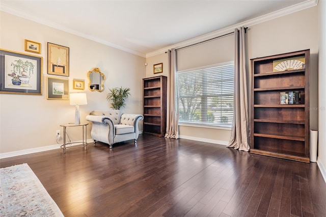 sitting room featuring crown molding, wood finished floors, and baseboards