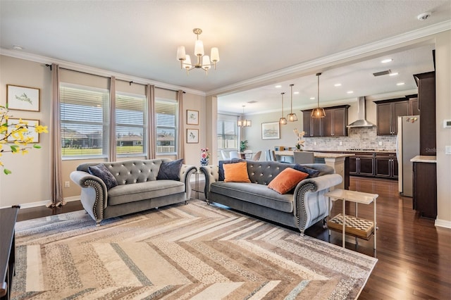 living room featuring dark wood-style floors, baseboards, an inviting chandelier, and ornamental molding