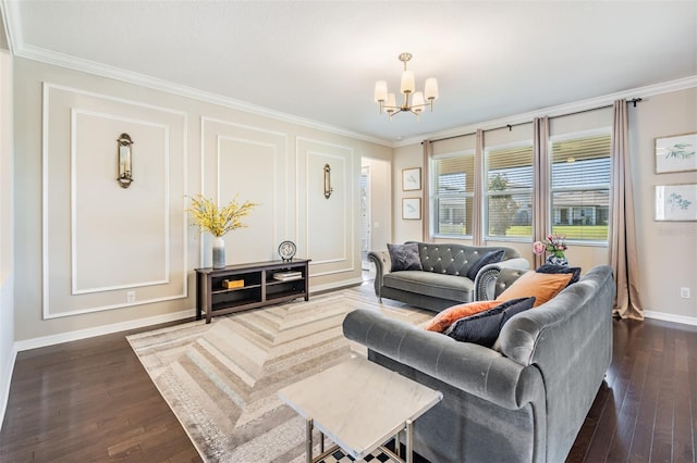 living room featuring dark wood finished floors, a notable chandelier, baseboards, and ornamental molding