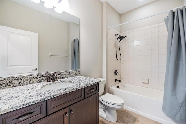 full bath with tile patterned flooring, shower / bath combination with curtain, toilet, and vanity