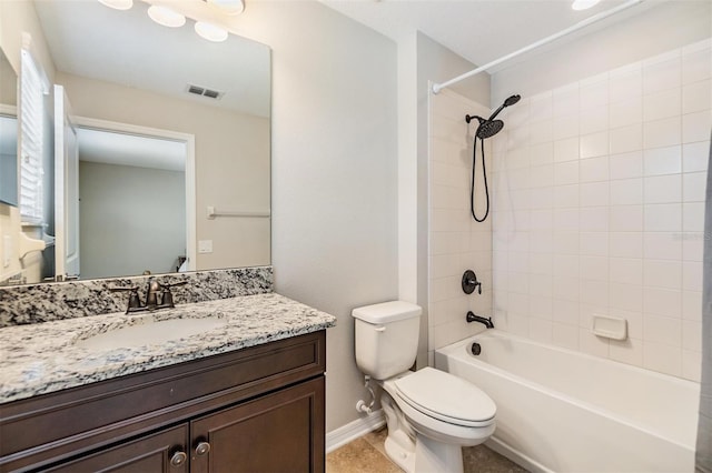 bathroom featuring visible vents, toilet, washtub / shower combination, baseboards, and vanity