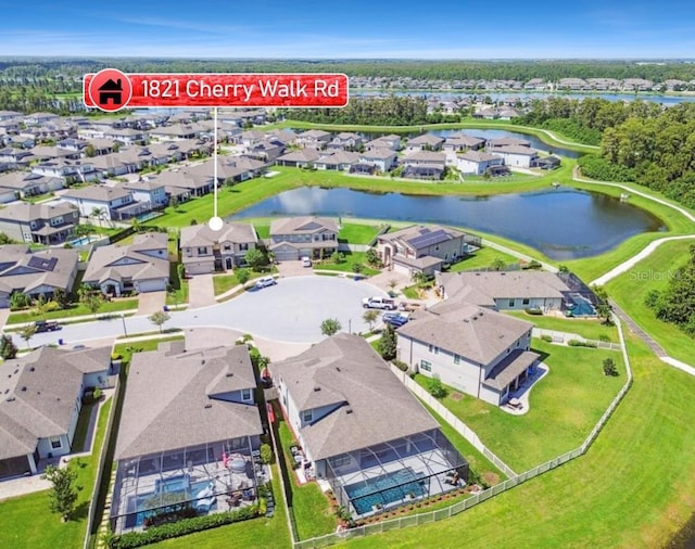 drone / aerial view featuring a residential view and a water view