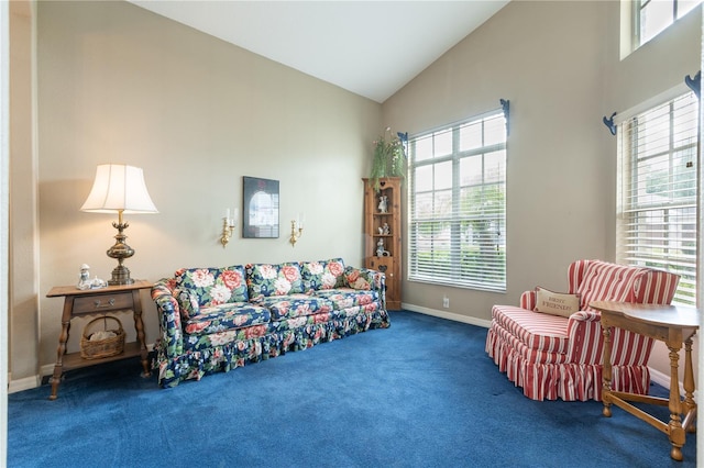 living room featuring high vaulted ceiling and carpet