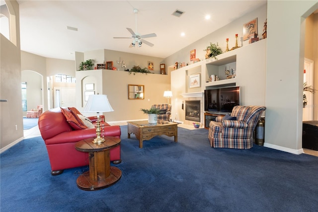 carpeted living room featuring ceiling fan