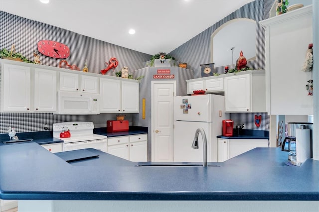 kitchen featuring white appliances, vaulted ceiling, sink, kitchen peninsula, and decorative backsplash