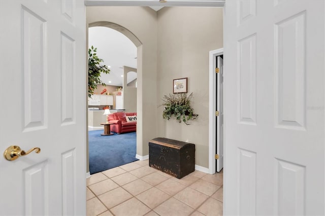 view of carpeted foyer entrance