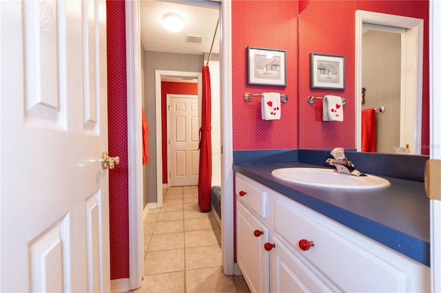 bathroom with vanity and tile patterned flooring