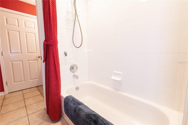 bathroom featuring tile patterned flooring and tiled shower / bath combo