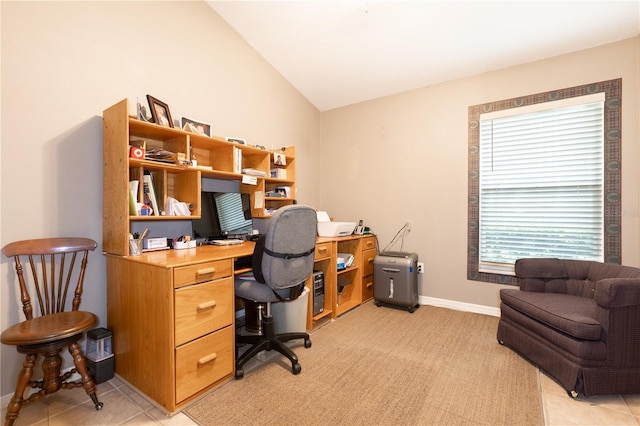 office space featuring light tile patterned flooring and lofted ceiling