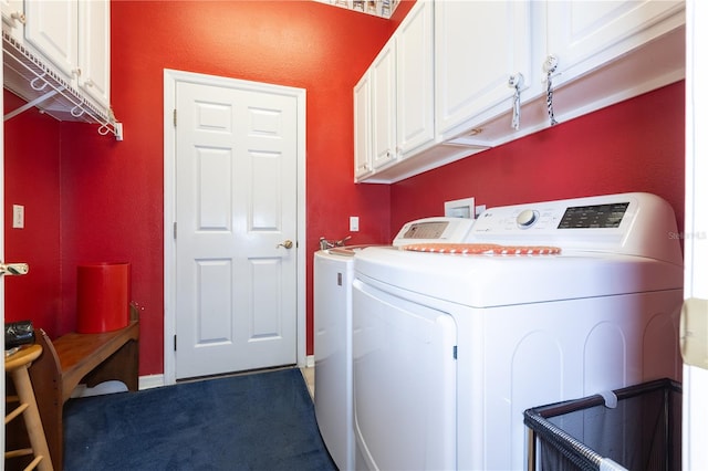 laundry area featuring washing machine and clothes dryer, carpet, and cabinets