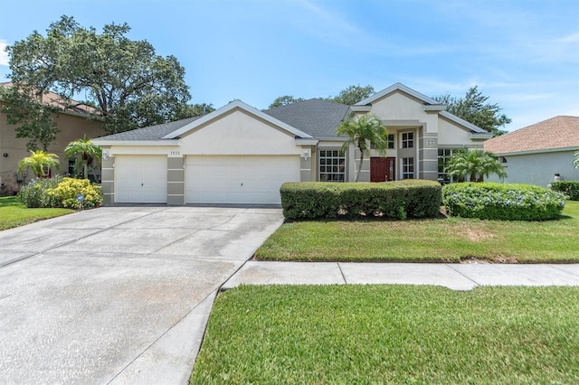 ranch-style house featuring a garage and a front yard