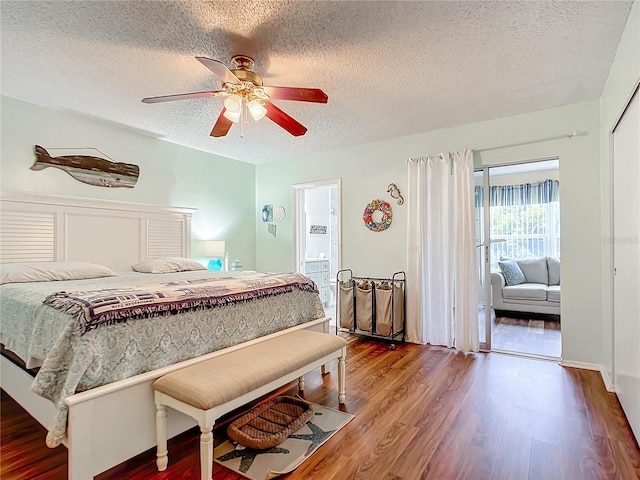 bedroom featuring ceiling fan, hardwood / wood-style floors, and a textured ceiling