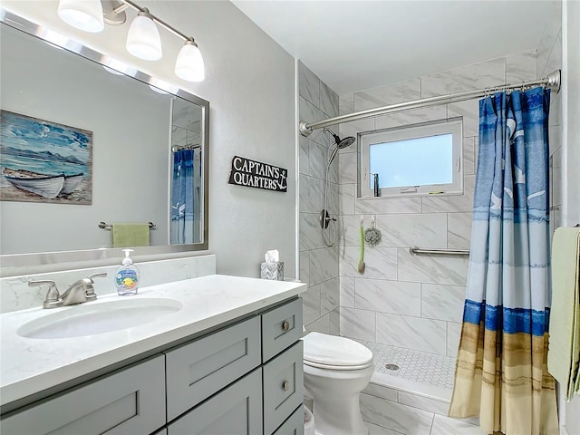 bathroom with tile patterned floors, toilet, vanity, and a shower with shower curtain