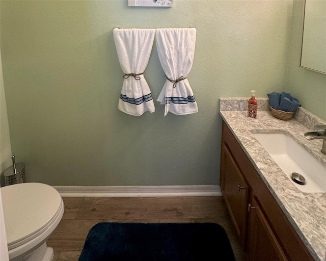 bathroom with vanity, tile patterned flooring, and toilet