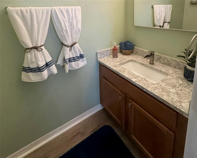 bathroom featuring vanity and wood-type flooring