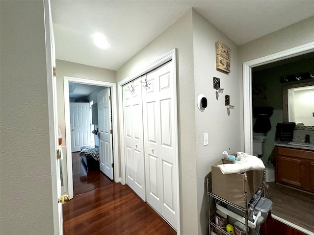 hallway featuring dark wood-type flooring