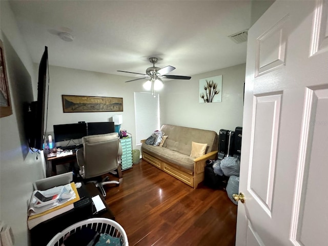 living room with dark hardwood / wood-style floors and ceiling fan