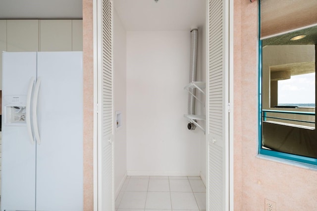 bathroom featuring baseboards and tile patterned floors