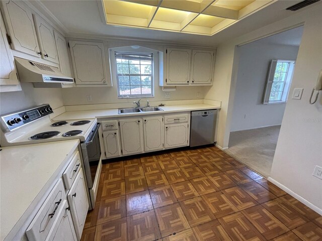 kitchen with sink, white range with electric stovetop, dishwasher, and dark carpet