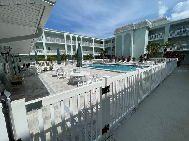 view of swimming pool with a patio