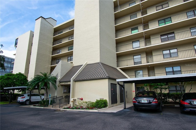 view of building exterior with a carport