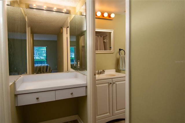 bathroom featuring vanity and a textured ceiling