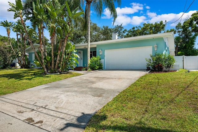 ranch-style home with a garage and a front yard