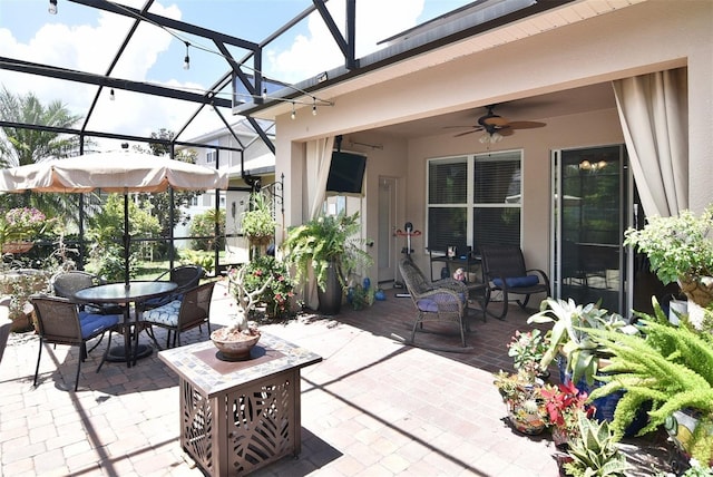 view of patio with a lanai and ceiling fan