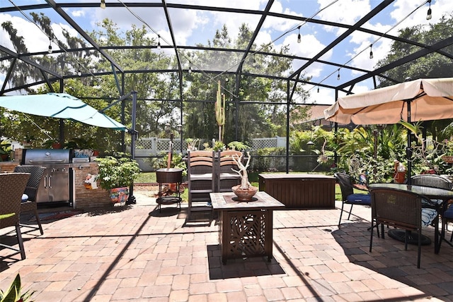 view of patio featuring glass enclosure and a jacuzzi