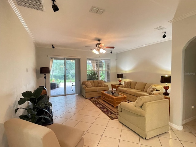 living room with crown molding, ceiling fan, and light tile patterned floors