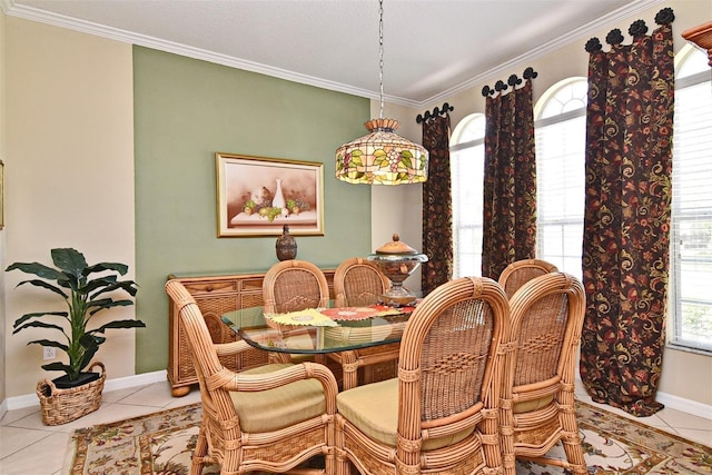 dining space with crown molding and light tile patterned flooring