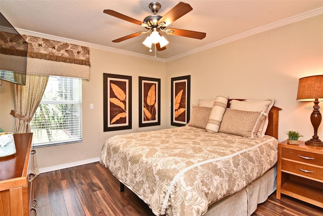 bedroom featuring ornamental molding, dark wood-type flooring, and ceiling fan