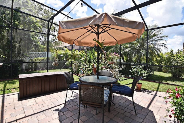 view of patio / terrace featuring glass enclosure