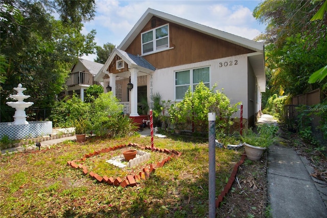 view of front of home featuring fence