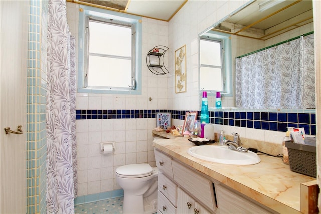 full bathroom featuring tile walls, a shower with shower curtain, toilet, vanity, and tile patterned floors