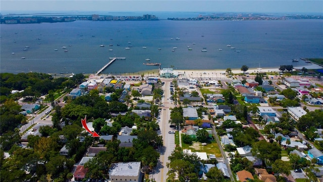 drone / aerial view with a water view and a residential view