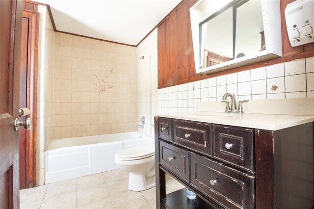 bathroom featuring tile walls, shower / bathtub combination, toilet, vanity, and tile patterned flooring