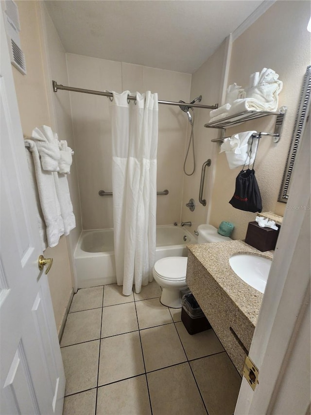 full bathroom featuring toilet, sink, shower / tub combo, and tile patterned flooring