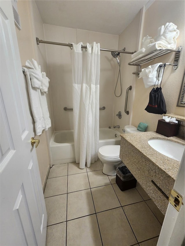 full bathroom featuring toilet, shower / bath combo, tile patterned floors, and sink