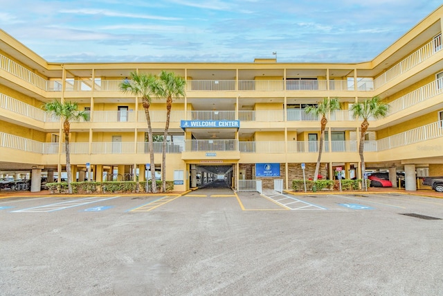 view of property featuring uncovered parking