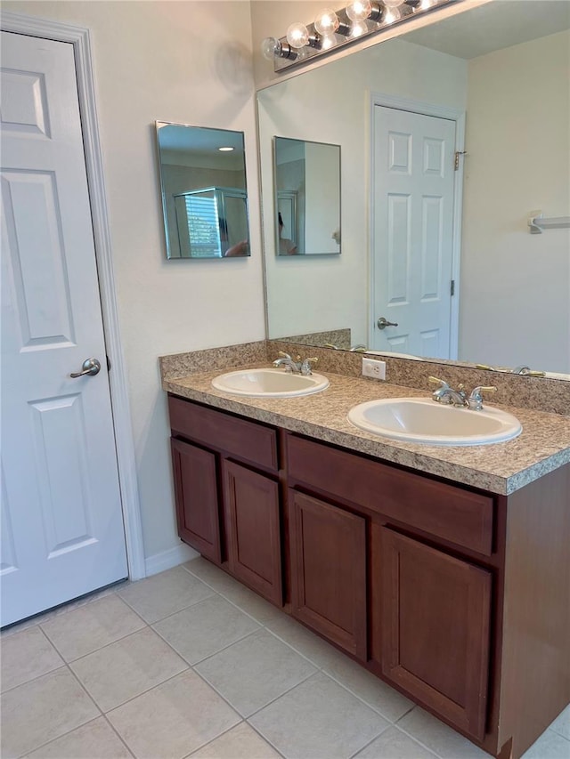 bathroom with vanity and tile patterned floors