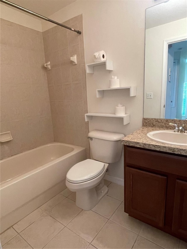 full bathroom featuring tile patterned flooring, vanity, toilet, and tiled shower / bath combo