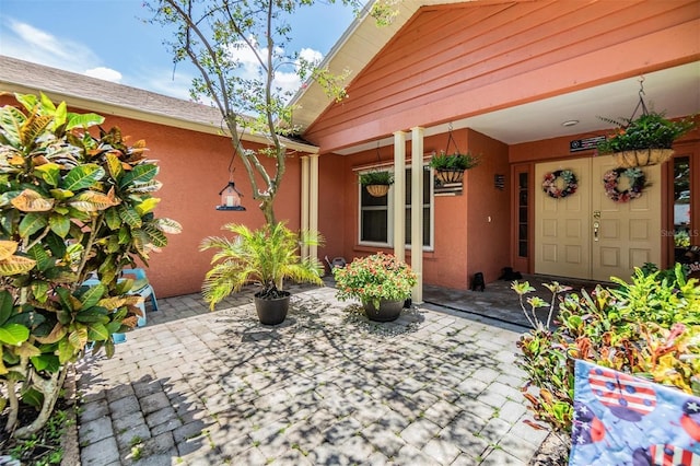 doorway to property featuring a patio area