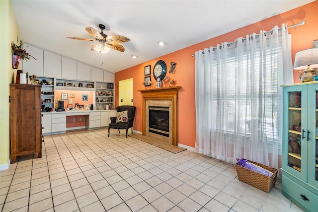 kitchen featuring light tile patterned flooring, white cabinetry, ceiling fan, and lofted ceiling