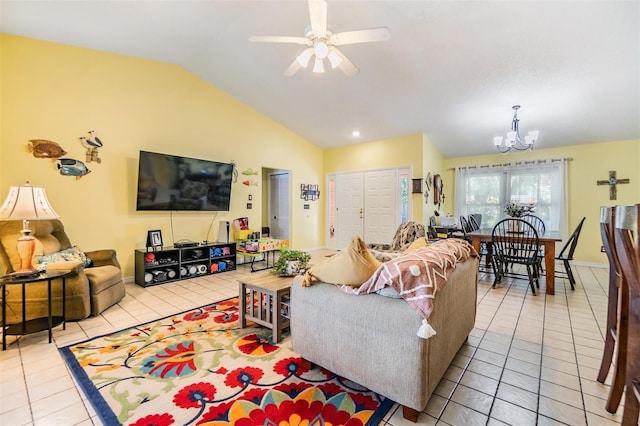 tiled living room featuring ceiling fan with notable chandelier and lofted ceiling